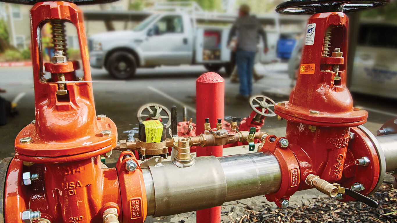 Backflow preventer installed in a commercial outdoor pipe.